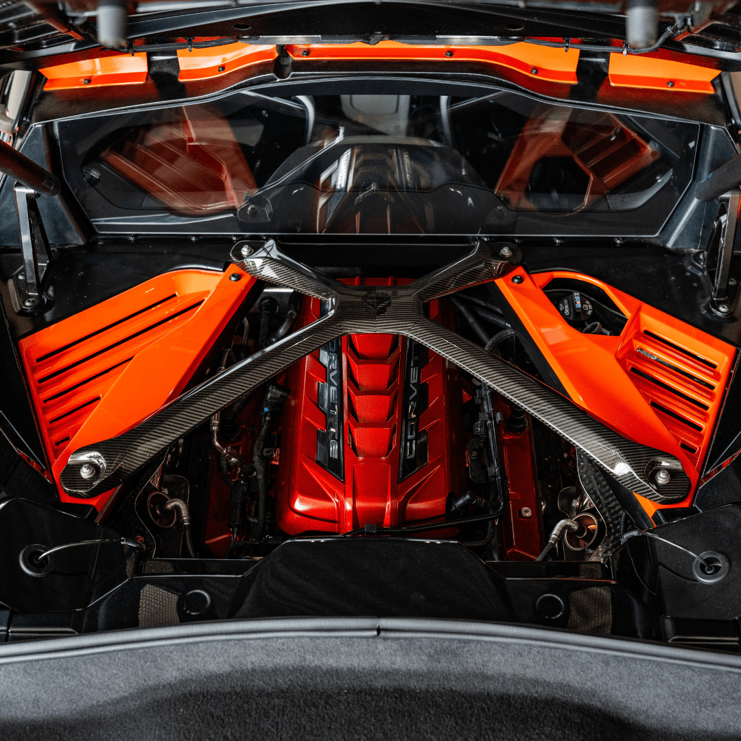 C8 Corvette Edge Red Engine Cover installed under a Carbon Fiber X-Brace