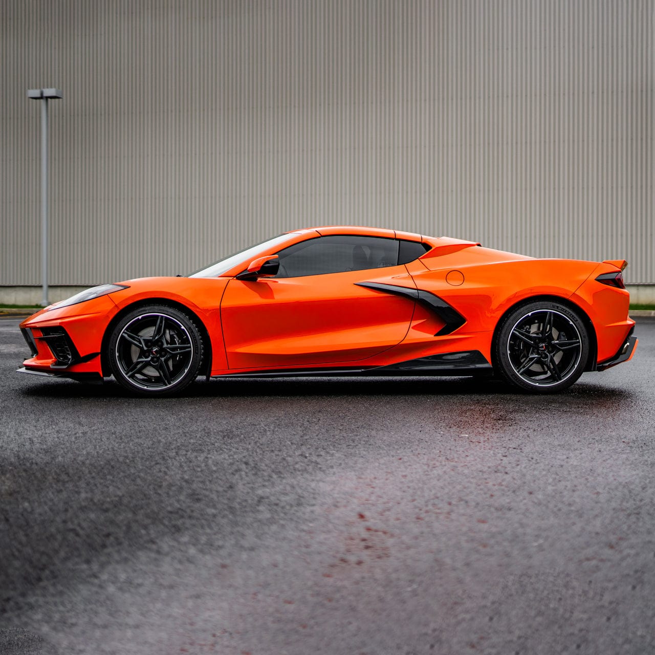 A Sebring Orange C8 Corvette Stingray with Sebring Orange RQ Intake Ports installed.