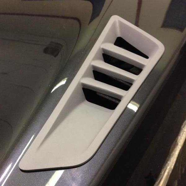 ACS Composite Upper Rear Quarter Ports for Camaro 2010-2015 Coupe, SKU 33-4-139 PRM - Rear view of Camaro with black quarter panel inserts featuring Stingray gill-inspired ports.