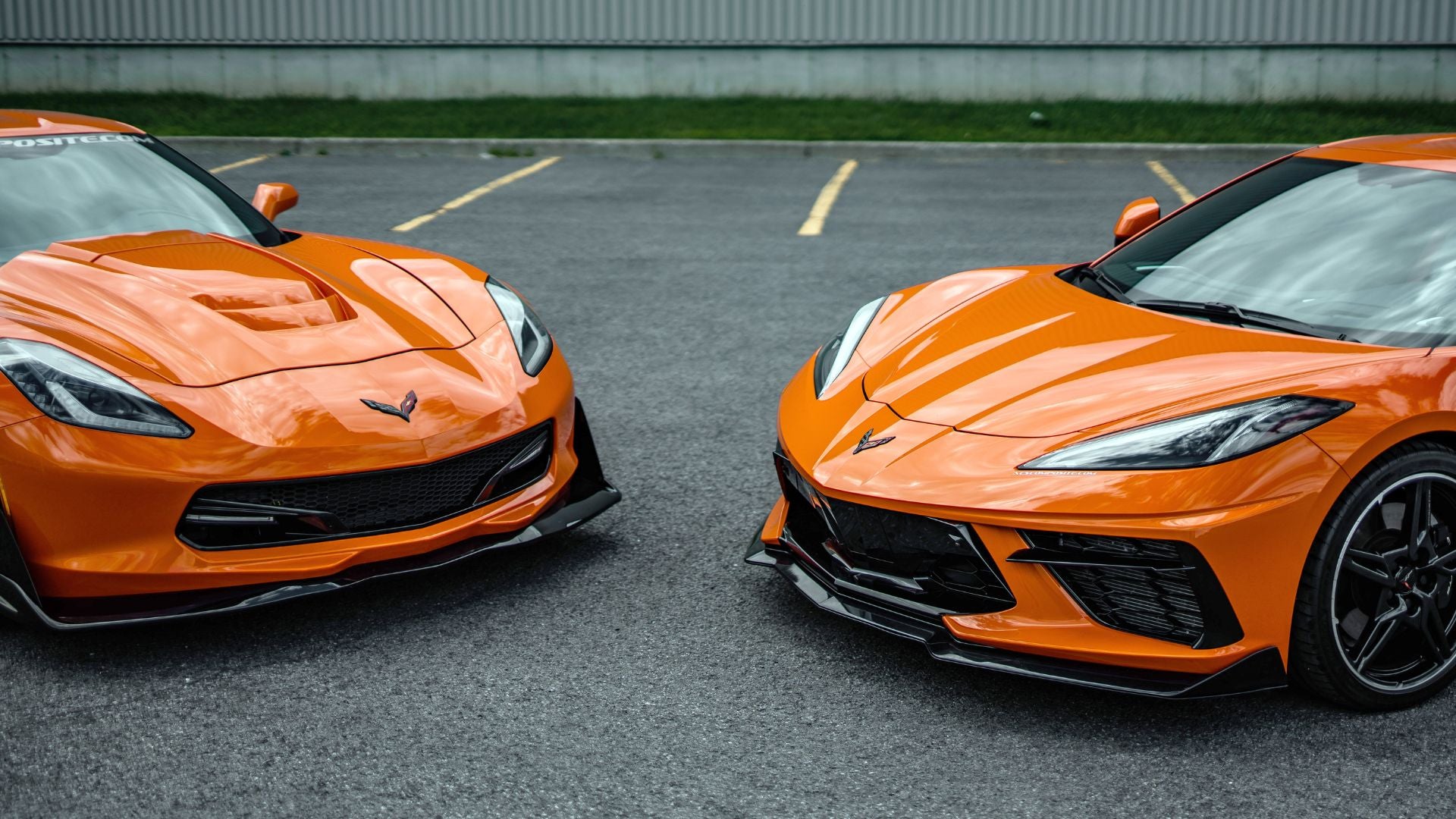 Two Sebring Orange Corvettes facing each other (C7 and C8)