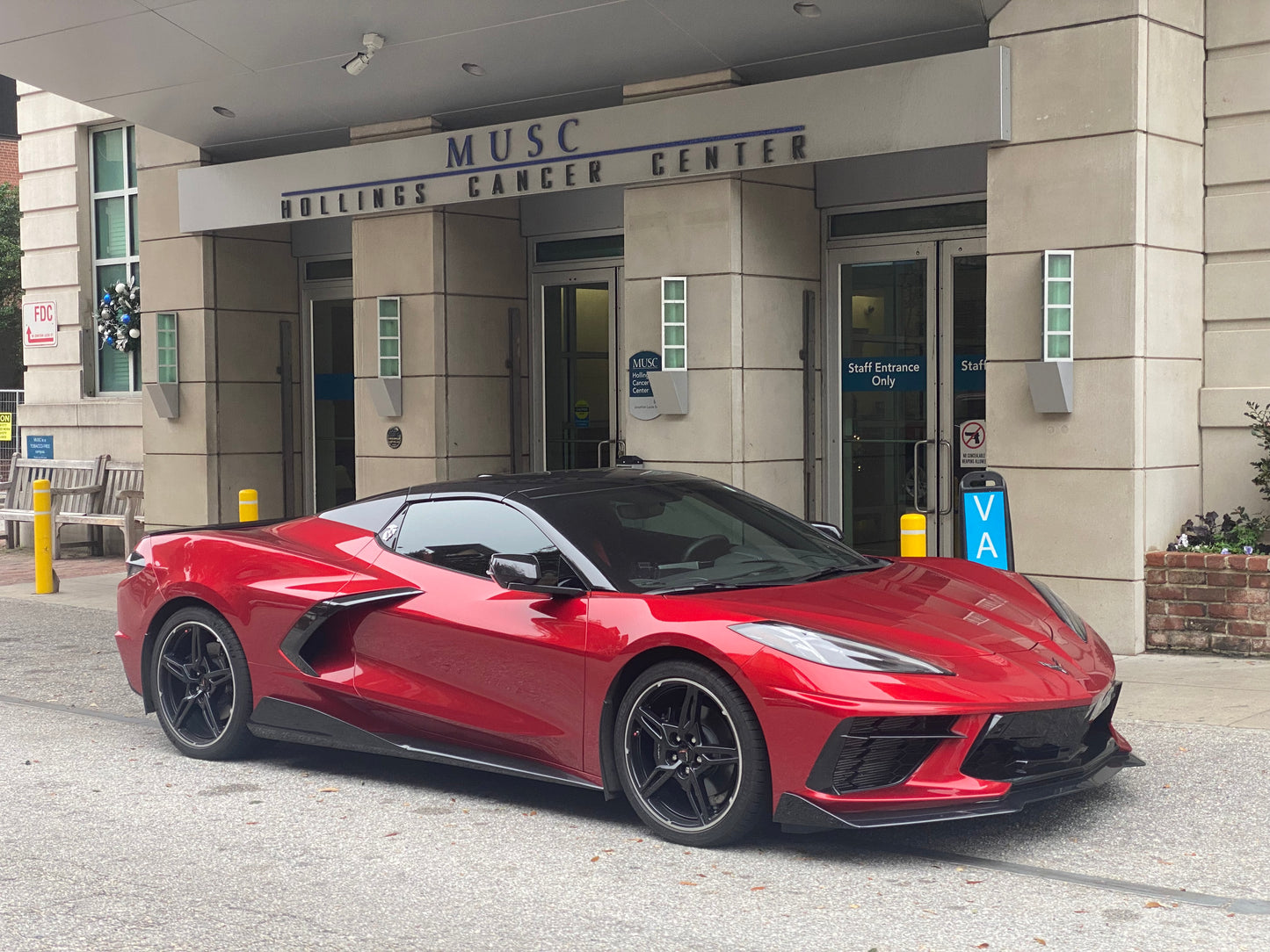 Charles girl Ravens 2023 Corvette Stingray 2LT in red-mist-metallic-tintcoat