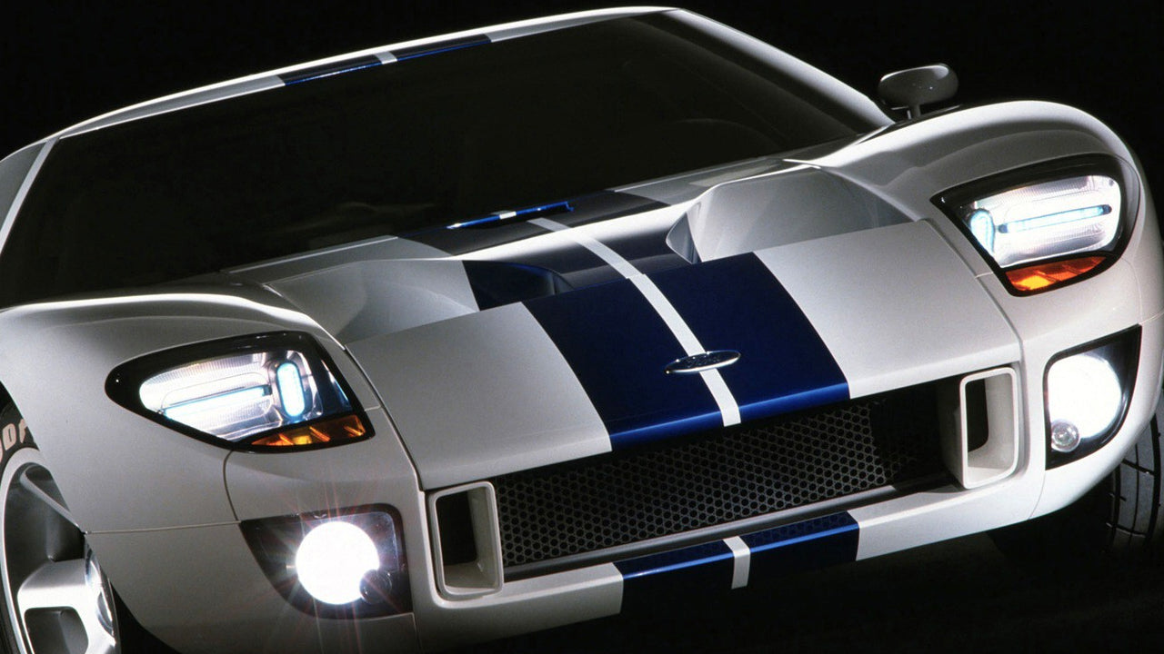 A silver and blue stripped Ford GT
