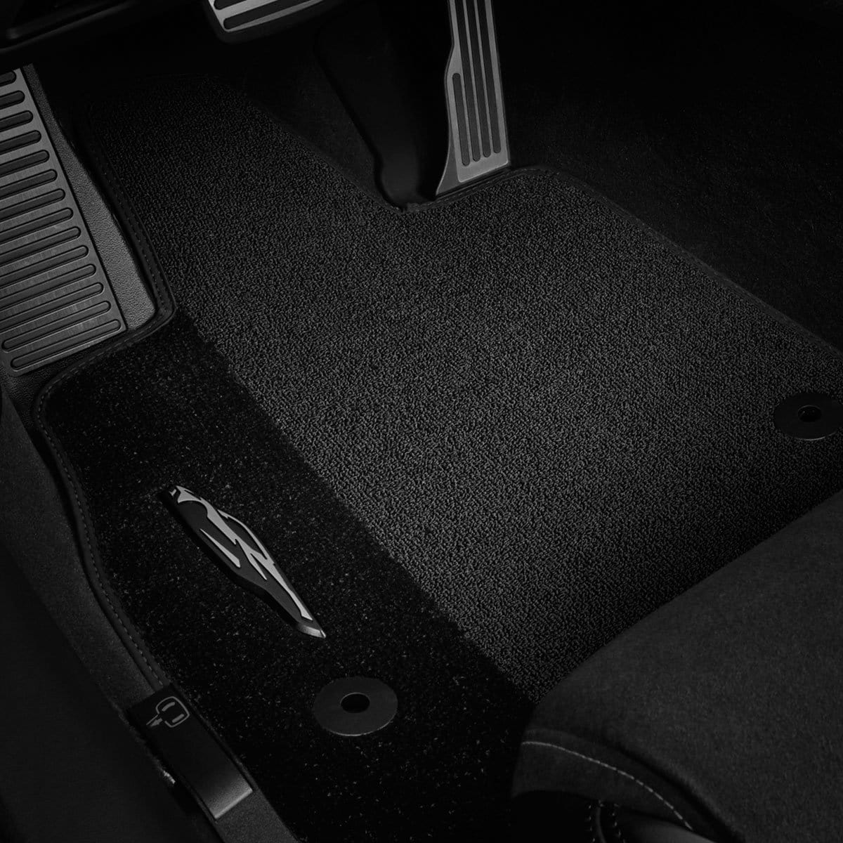 Black C8 Carpeted Floor Mats with Corvette Silhouette, SKU 50-4-029, protecting car interior from debris and wear and tear.