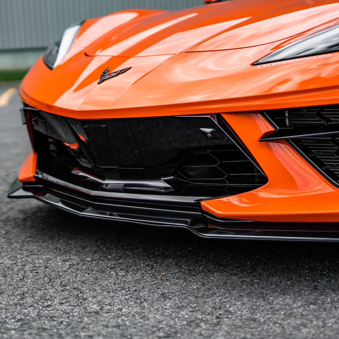 ACS Composite C8 Splitter Undertray (SKU nan) - Eye-level view of the undertray system installed on a C8 Corvette Stingray. Protects the front splitter and improves aerodynamics.